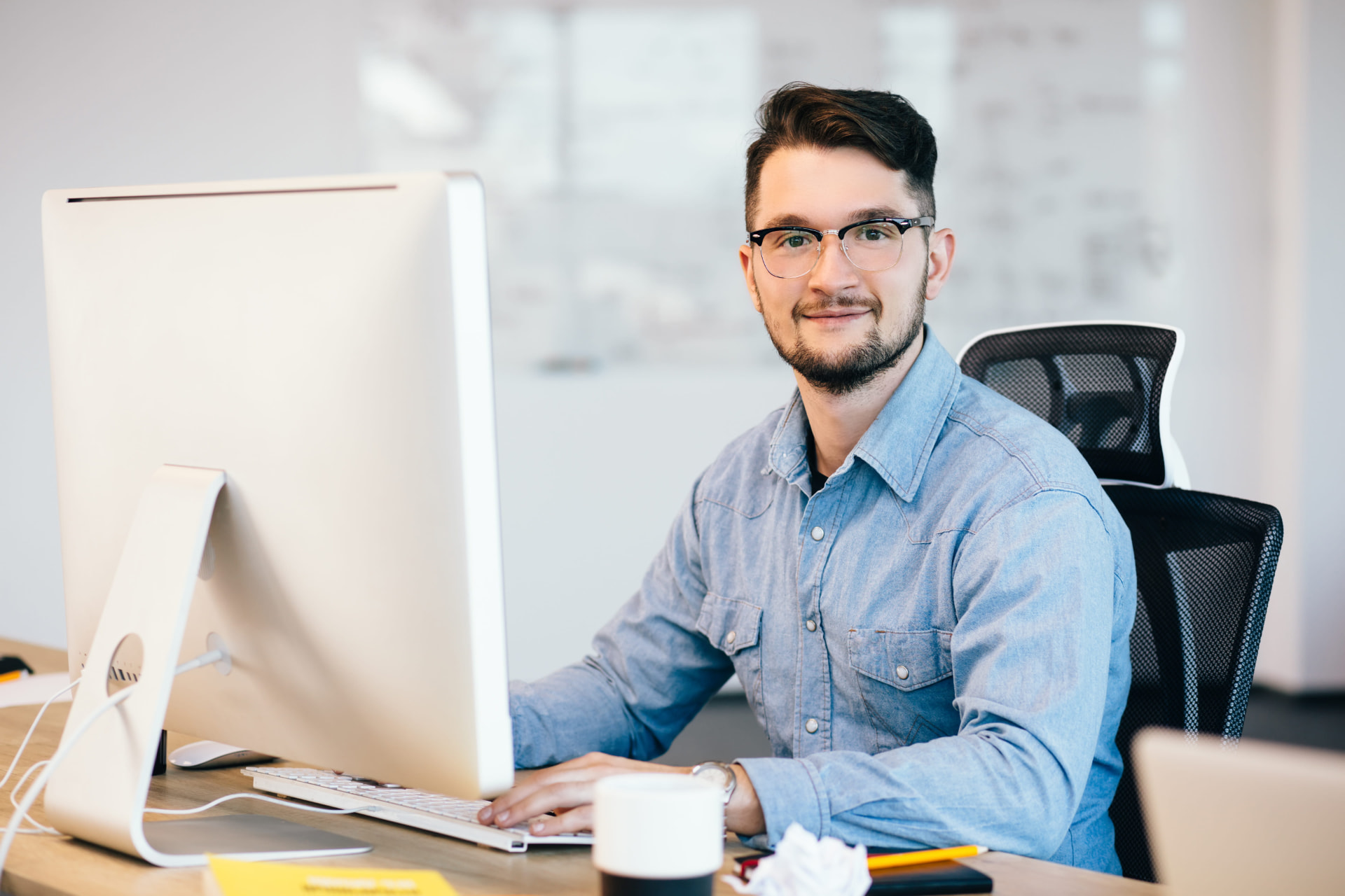 Senior marketing practitioner at his desk working on a spa client account